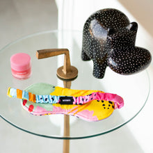 Load image into Gallery viewer, MiliMili power nap eye mask in modern rainbow print designed in collaboration with Pronoun by Jesse Tyler Ferguson as shown in Jesse's Bathroom