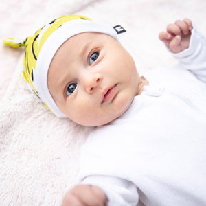 Milimili Kona Banana Beanie in bamboo jersey, shown on six-month-old baby