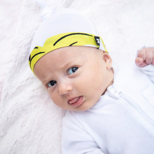 Milimili Kona Banana Beanie in bamboo jersey, shown on six-month-old baby