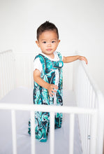 Load image into Gallery viewer, safe bamboo sleep sack, safe sleep sack, baby standing in white crib, wearing palm print / banana leaf print sleep sack with white pompom trim - available in XL toddler size sleep sack