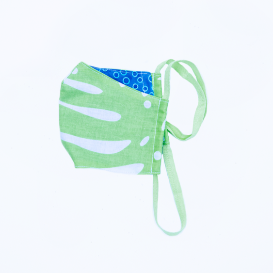 tropical palm leaf kids' face mask in breathable 100% cotton with blue backing