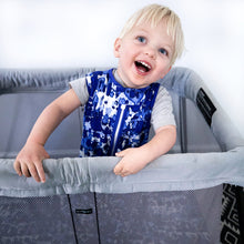 Load image into Gallery viewer, Toddler wearing MiliMili Playa Blue tie dye sleep sack in pack and play with MiliMili travel sheet. Made in the USA from bamboo jersey. Best sleep sacks for toddlers. safe bamboo sleep sack, safe sleep sack