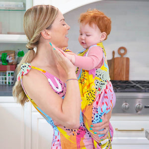Mom and Daughter wearing matching MiliMili x Pronoun by Jesse Tyler Ferguson Sleep & Play Romper and Wearable Blanket