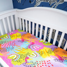 Load image into Gallery viewer, Modern Rainbow crib sheets as shown in white crib with scalamandre zebra print paper on walls, created by MiliMili in collaboration with Pronoun by Jesse Tyler Ferguson