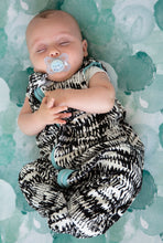 Load image into Gallery viewer, Baby wearing modern black and white sleep sack in the softest bamboo jersey, on top of teal bubbles print bassinet sheet. 