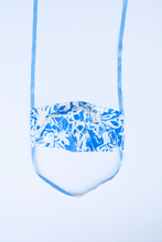 Load image into Gallery viewer, front of azul milimili tropical face mask showing blue abstract print