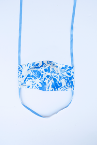 front of azul milimili tropical face mask showing blue abstract print