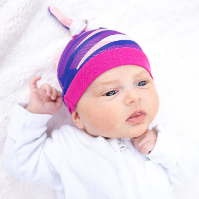 Milimili Puebla Rosa Beanie in bamboo jersey, shown on six-month-old baby