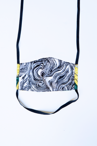 back of milimili banana tropical face mask - featuring black and white marble print
