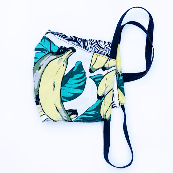banana print tropical fabric face masks, reversible with black and white marbled back. 