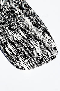 Close up shot of Kilauea (modern abstract black and white) print bassinet sheet