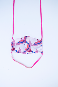 front of milimili crane face mask - featuring pink, blue and lilac bird print