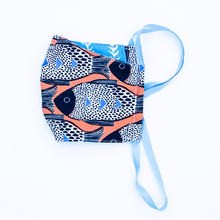 Load image into Gallery viewer, orange blue and black fish print cloth face mask with blue and white striped backing and blue straps.