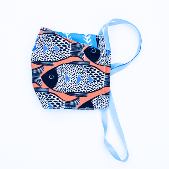 orange blue and black fish print cloth face mask with blue and white striped backing and blue straps.