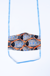 front of milimili fish face mask - featuring orange blue and black fish print