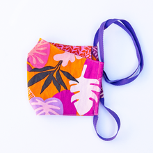 Load image into Gallery viewer, MiliMili face mask with Tropical purple orange and pink print front with reversible red and pink floral print back. 