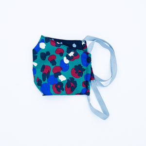 teal red and blue leopard print kids' face mask in breathable 100% cotton with black backing