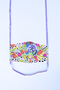 front of milimili monkey print face mask, featuring whimsical purple monkey with red cherries on green branches and black polka dots