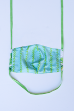 Load image into Gallery viewer, back of milimili monstera face mask - featuring blue and green vine print