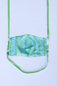 back of milimili monstera face mask - featuring blue and green vine print