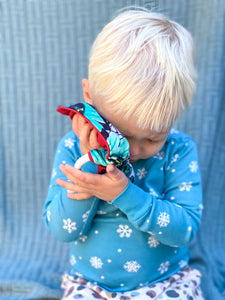MiliMili Holiday Lovey held by toddler
