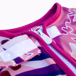 Zipper detail on puebla rosa sleep sack, floral design featuring pinks, navy, and purple with pink trim. The best sleep sacks for summer. safe bamboo sleep sack, safe sleep sack