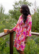 Load image into Gallery viewer, woman wearing tropical lightweight robe while enjoying coffee